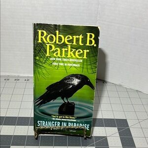 Green 'Stranger in Paradise' Paperback Book